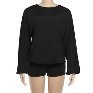 Detailed view of women's black long sleeve romper with round neck and batwing style