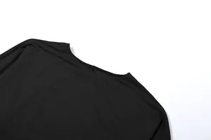 Close-up detail of a minimalist black round neck long sleeve bodysuit for women