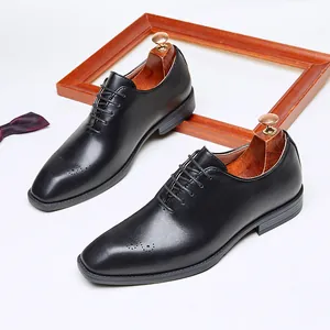 Classic black men's brogue oxford dress shoes with elegant wingtip detailing for weddings