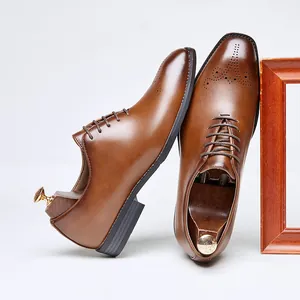 Elegant brown leather brogue oxford shoes for men with wingtip detail and square toe
