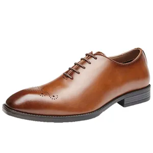 Classic brown leather men's brogue Oxford shoes with elegant carved wingtip details.