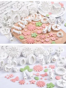 Comprehensive 33-piece set of fondant molds featuring flower, leaf, and butterfly plunger shapes.
