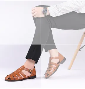 Detailed view of men's brown leather gladiator sandals with an adjustable buckle strap.