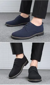 Λεπτομερής προβολή ανδρικών παπουτσιών Brogue από σουέτ σε μπλε σκούρο και μαύρο χρώμα