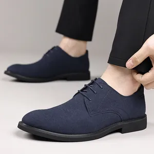 Detailed side view of navy blue suede oxfords for men in a British casual style.