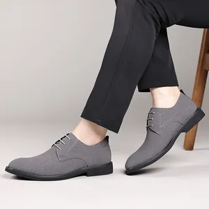 Close-up detail shot of elegant grey British style pointed casual leather shoes for men