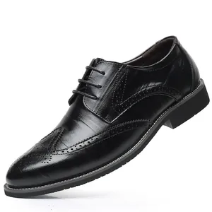 Classic men's black leather business dress shoes with brogue wingtip detail
