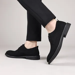 Side view of black suede pointed-toe derby shoes for men in a smart casual outfit.