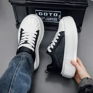 Detail shot of men's chunky sneakers with black leather and white shell toe