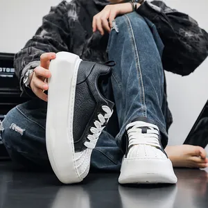 Detailed view of stylish black and white thick-soled shell-toe sneakers for men