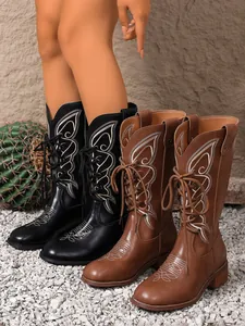 Elegant western boots featuring intricate butterfly embroidery in black and brown