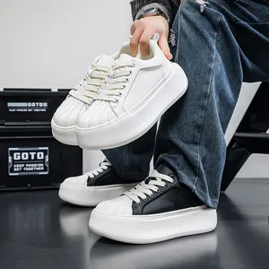 Close-up of stylish thick-soled shell-toe sneakers in white and black