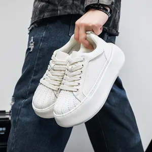 Fashionable white men's platform sneakers with shell toe design shown in detail