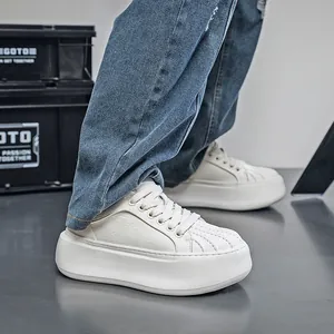 Close-up detail of white shell-toe platform sneakers for men, modern dad shoe style