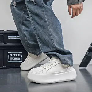 Macro view of trendy white shell-toe platform sneakers featuring extra thick soles