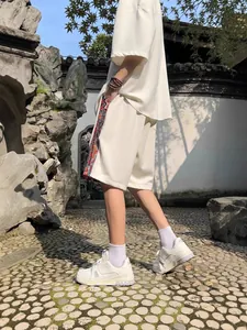 Men's off-white ethnic style linen shorts with patterned side stripe for summer