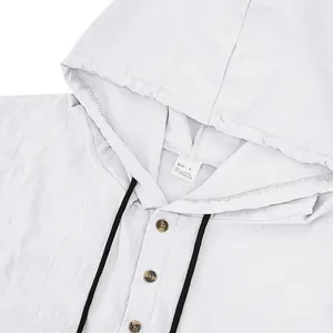 Detail view of men's linen hooded Henley shirt showing collar, buttons, and size tag