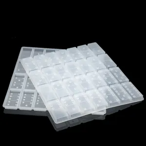 Detailed view of two translucent silicone domino molds designed for DIY resin casting crafts.