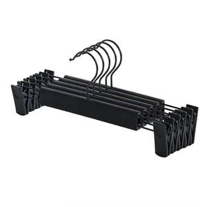 Lot de 5 cintres à pantalons noirs antidérapants avec pinces réglables pour jupes.