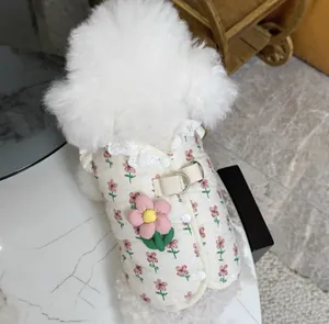 Detailed view of cream floral quilted pet vest with harness ring and lace collar for small dogs