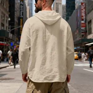 Back view of a men's breathable beige linen hooded shirt in a casual city setting