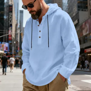 Close-up detail of a light blue linen hooded Henley shirt with breathable fabric