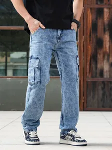 Detail shot of men's blue acid wash cargo jeans with multiple functional pockets