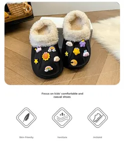 Close-up of kids warm black cotton slippers featuring soft white fur lining and cute cartoon charms