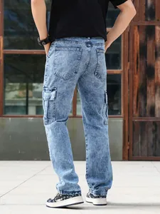 Back view of men's vintage wash cargo jeans featuring a functional multi-pocket design