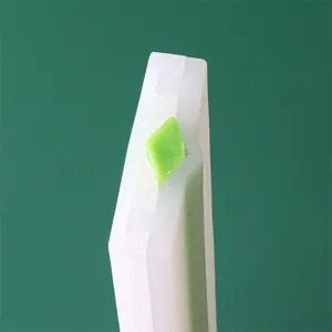 Detail shot of the precise diamond core within a white silicone soap tube mold.