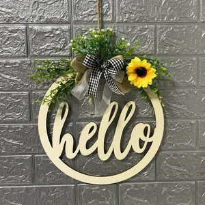 Detail view of rustic wooden hello door wreath with sunflower and greenery decoration