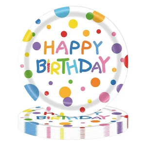 Close-up detail of colorful polka dot disposable paper plates with Happy Birthday text