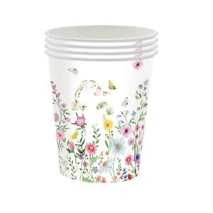 Detailed view of stacked disposable paper cups with elegant wildflower and butterfly print