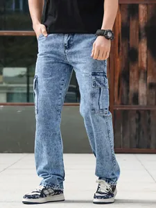Detail shot of men's vintage blue cargo denim pants with side flap pockets