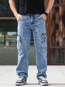 Men's loose straight-leg denim cargo pants with multiple pockets in vintage blue wash