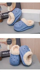Close-up of warm fleece lining and waterproof exterior of kids' winter slippers in blue color.