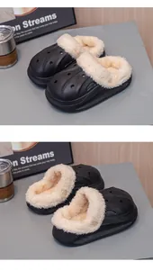 Close-up detail of children's black waterproof slippers with cozy beige fleece lining