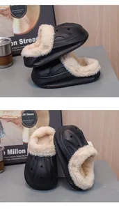 Close-up of black children's winter clogs featuring soft warm fleece lining and waterproof EVA.