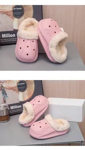 Close-up of pink kids' waterproof winter clogs with soft plush lining for home warmth