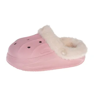Pink children's winter clogs with warm white faux fur lining and waterproof EVA upper