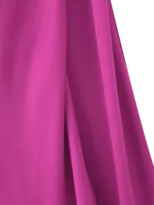 Close-up of vibrant magenta silk satin fabric with elegant drape and soft sheen.