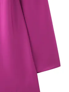 Detailed view of the vibrant fuchsia satin fabric with a smooth texture and soft sheen
