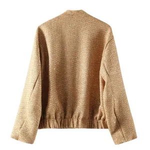 Back view of golden sequin fashion jacket showing shimmering fabric and elastic hem
