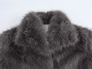 Close-up macro view showing the soft plush texture of a grey faux fur coat collar