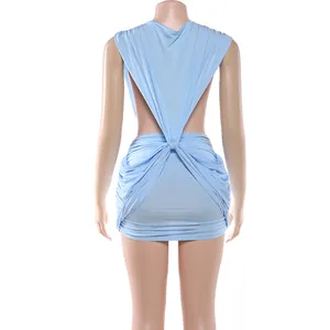 Close-up of light blue backless mini dress with elegant draped knot and pleated design