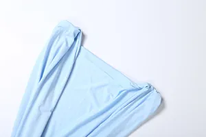Detailed macro shot of light blue deep V-neck pleated sleeveless bodycon dress