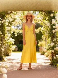 Elegant yellow satin V-neck spaghetti strap midi dress with lace trim for summer garden