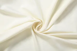 High-quality close-up detail of the soft white elastic fabric for this elegant slim fit dress