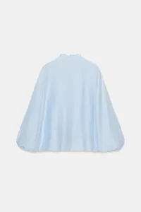 Back view of a light blue long-sleeve blouse featuring a ruffled collar and shimmery texture.