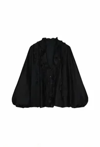 Detailed view of an elegant black French style ruffled V-neck blouse with lantern sleeves